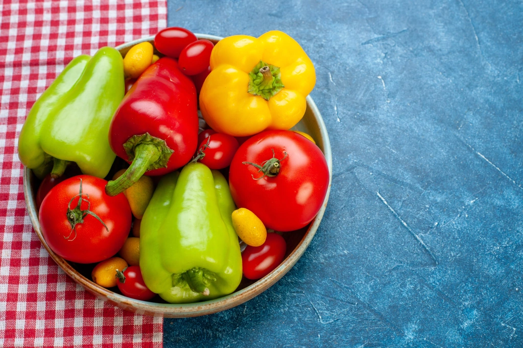 bottom-view-fresh-vegetables-cherry-tomatoes-different-colors-bell-peppers-tomatoes-cumcuat-platter-.webp