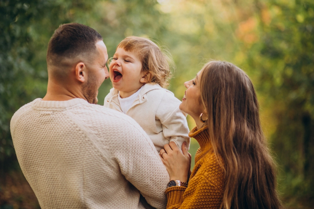 young-family-with-children-autumn-park.webp